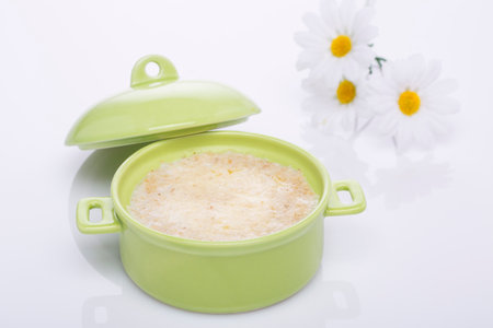 Oatmeal and bran in a green pot. Healthy food.の写真素材