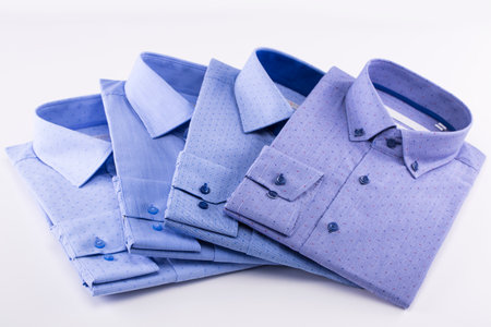 Shirts in blue on a white backgroundの写真素材
