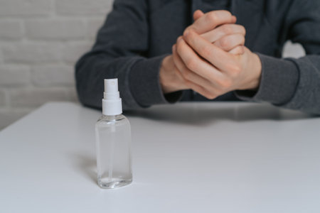 Deficiency of alcohol antiseptic in the world. Hand disinfection with aniseptic. Personal hygiene will save you from the virusの写真素材