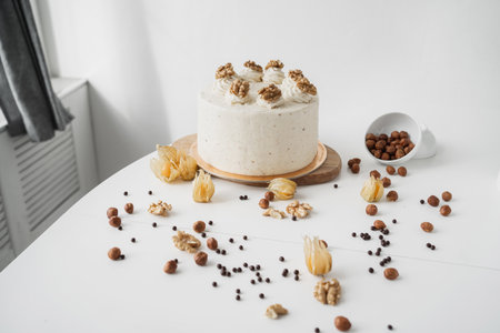 Beautiful cake with walnuts. Chocolate sponge cake with cream cheese and nuts. Homemade birthday...