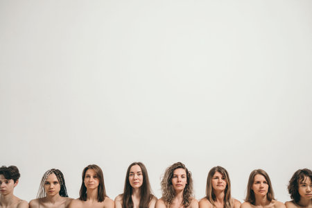Beautiful girls with natural beauty. Heads of different women in the same frame. Place for your text. Black and white photo with a group of girls.の写真素材