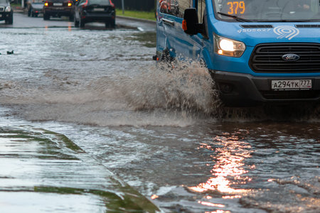 Moscow 06/18/2020 Cars after heavy rain driving in water flood, fixed route taxi-bus closeup