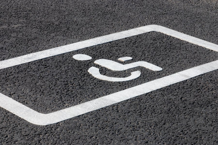 parking spot for disabled drivers, road marking on asphalt roadの写真素材