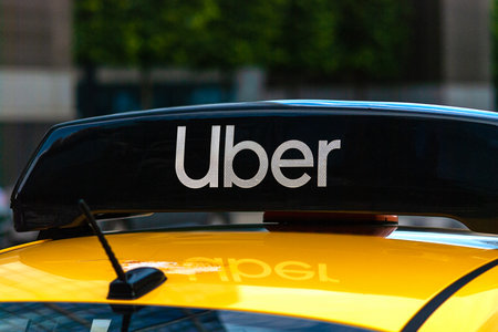 Uber logo icon on top of yellow taxi cab, close up - Moscow, 09 // 09/2020