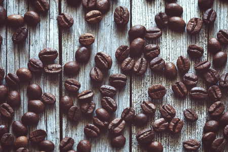 coffee beans on old wooden surfaceの写真素材