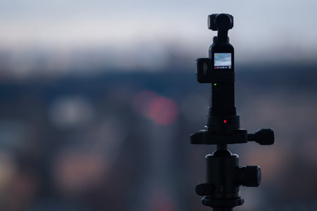DJI Osmo Pocket camera capturing time lapse - action camera working mounted on tripod, Moscow, 21 April 2021のeditorial素材