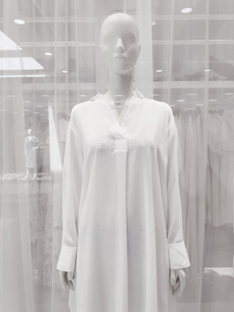 Clothing store window, mannequin in white shirtの写真素材