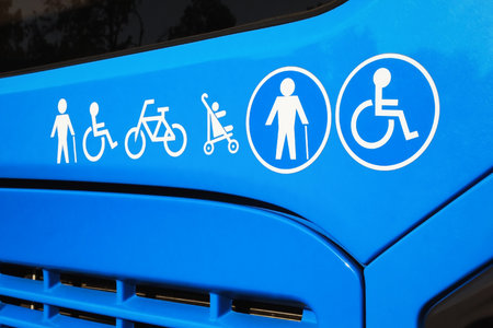 Disabled sign, elderly people, baby carriage and bicycle icons on city bus. Public transportation accessibility conceptの写真素材