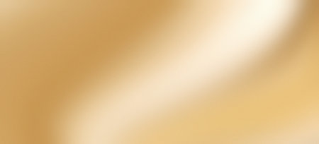 Abstract golden background silk satin smooth yellow luxury drapery grainy gradient texture copy spaceの写真素材