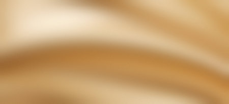 Golden silk satin smooth yellow background luxury drapery grainy gradient textureの写真素材