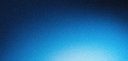 Blue gradient background grainy glowing blue light on dark backdrop, noise texture effect banner header designの写真素材