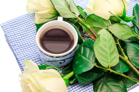 cup of coffee decorated white with flowersの写真素材