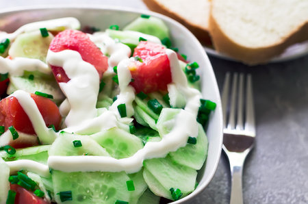 salad from fresh cucumbers and tomatoの写真素材
