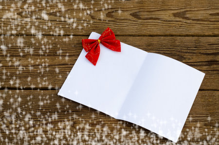 Christmas card with a sheet of paperの写真素材