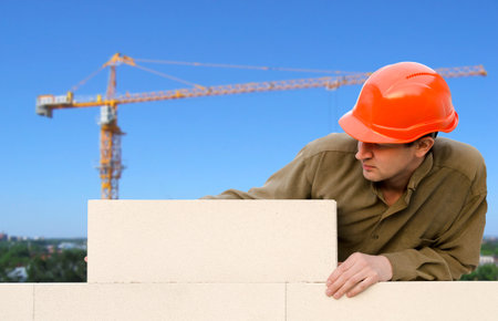 worker builds a wallの写真素材