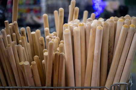 wooden stick for the handle of a shovel, the shovel at the hardware store