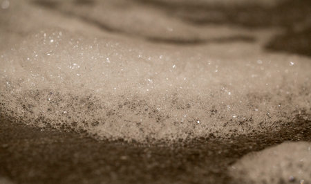 soap foam on grey tile