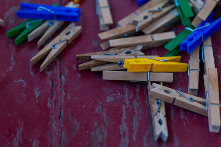 retro wooden clothespins on wood surface