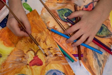 children's drawing of a red cat, children's creativity with pencils and paintsの写真素材