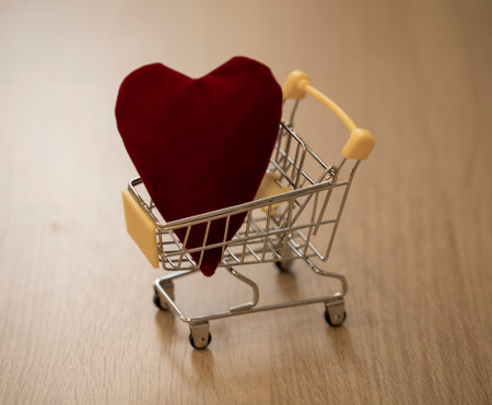 heart in a grocery cart. concept photo about love and the price of love in bright colorsの写真素材