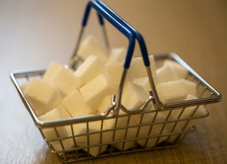 sugar in a grocery cart in light colors with partial blurring. conceptual photo about the harm of sugar to the bodyの写真素材