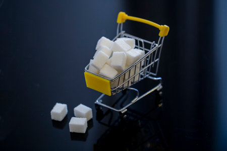 sugar in a grocery cart in light colors with partial blurring. conceptual photo about the harm of sugar to the bodyの写真素材