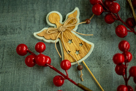 Christmas decorations wooden angel on wooden background close up