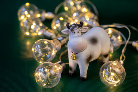 symbol of 2021, year of the bull, cow on a green background close-upの写真素材