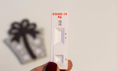 virus test taken on the eve of the holiday with holiday accessories close-upの写真素材