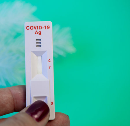 virus test taken on the eve of the holiday with holiday accessories close-upの写真素材