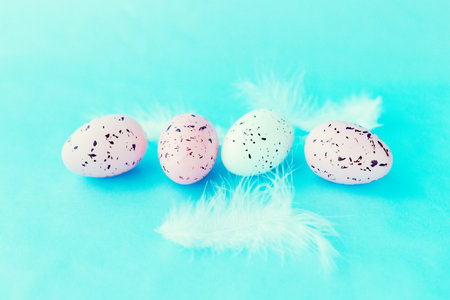bright easter eggs on a blue plain surface, easter decor, close-up
