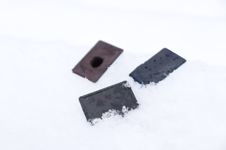 cuvettes with watercolors in the snow. Watercolor paints on a white background.の写真素材