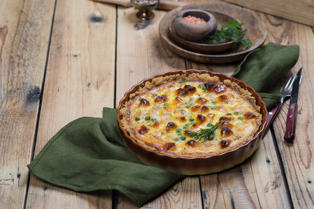 Round ruddy open pie with vegetable and cheese fillingの写真素材