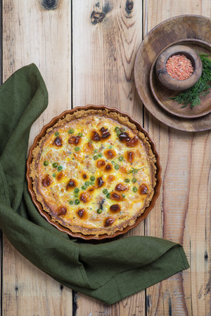 Round ruddy open pie with vegetable and cheese fillingの写真素材
