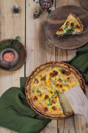 Open French Cake. Quiche with cream cheese, green peas. On wooden plank background.の写真素材