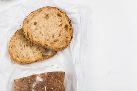 cut into slices of a loaf of dark bread made from rye flour