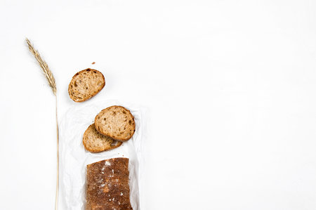 cut into slices of a loaf of dark bread made from rye flourの写真素材