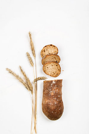 cut into slices of a loaf of dark bread made from rye flourの写真素材