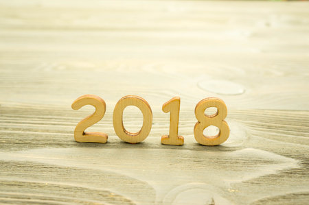2018 the year of the wooden figures on wooden backgroundの写真素材