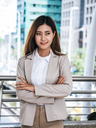 Portrait of a business woman in a suit standing outdoors. Business and lifestyle concept.の写真素材