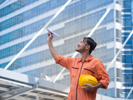 Smart engineer enjoy to play a rocket paper. Relaxing after successful work.の写真素材