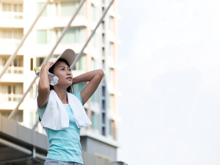 Healthy young asian woman exercising  in the city.  Fitness, sport, friendship and healthy lifestyle concept.の写真素材