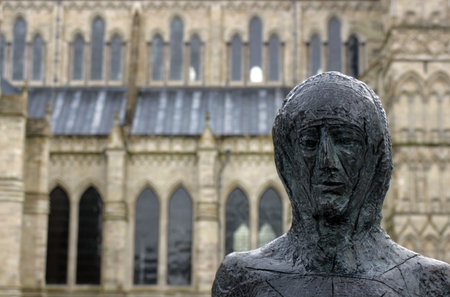 The head and shoulders of a public religious bronze sculpture located outside Salisbury in Wiltshire south of Englandの写真素材