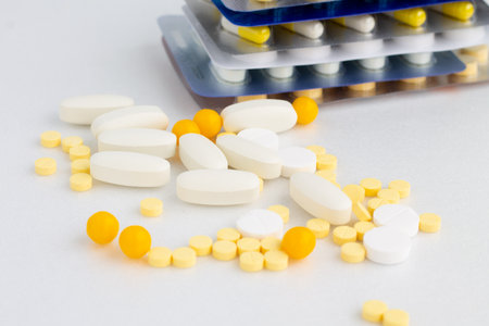 A lot of pills on a white background. Drug treatment