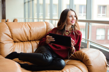 beautiful fashion girl in airport lounge indoor