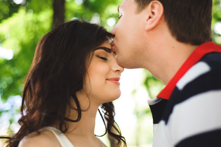 Young couple at the park in summer dayの写真素材