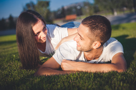 Young couple in love in the summer parkの写真素材