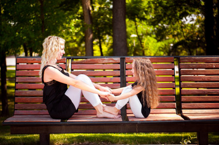 Mather and her daughter in the park.の写真素材