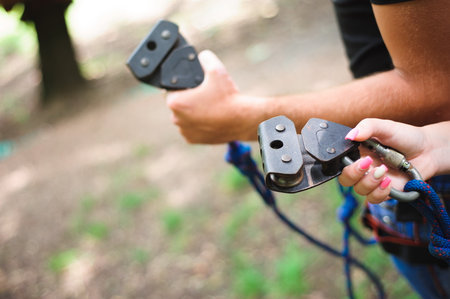 Hiking in the rope park two young peopleの写真素材