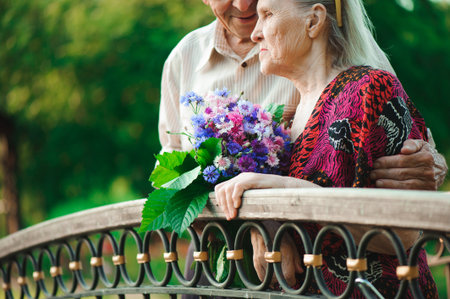 Happy senior couple outdoors in the parkの写真素材